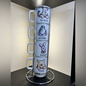 Set of four Disney Winnie The Pooh mugs with stand